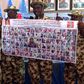 Chief of Army Staff, Tukur Buratai displays photos of 100 wanted Boko Haram terrorists
