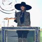 Beyonce receives the 2016 CFDA Fashion Icon Award in a shimmering Givenchy suit and hat