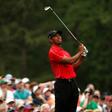 Tiger Woods of the U.S. watches his shot off the 12th tee during final round play of the Masters golf tournament at the Augusta National Golf Course in Augusta, Georgia April 12, 2015.   REUTERS/Jim Young
