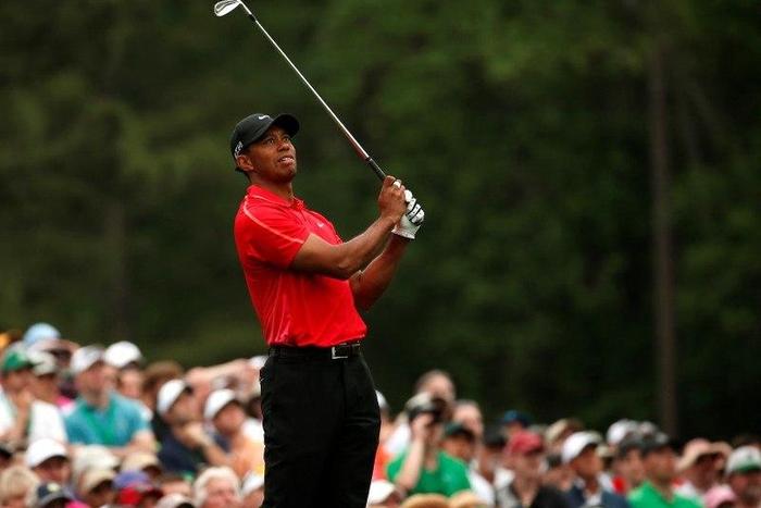 Tiger Woods of the U.S. watches his shot off the 12th tee during final round play of the Masters golf tournament at the Augusta National Golf Course in Augusta, Georgia April 12, 2015.   REUTERS/Jim Young