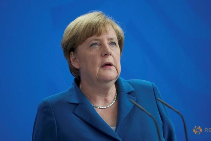 After attacks, Merkel cuts short holiday to face refugee policy storm