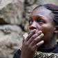 A woman reacts as rescue workers search for residents feared trapped in the rubble of a six-storey building that collapsed after days of heavy rain, in Nairobi, Kenya April 30, 2016.