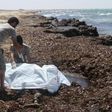 Guards place the body of a migrant into a body bag after a boat sank off the coastal town of Zuwara, west of Tripoli, Libya June 4, 2016.