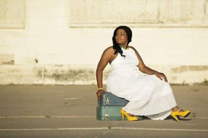 ___5156725___https:______static.pulse.com.gh___webservice___escenic___binary___5156725___2016___6___16___12___african-american-woman-sitting-on-suitcases