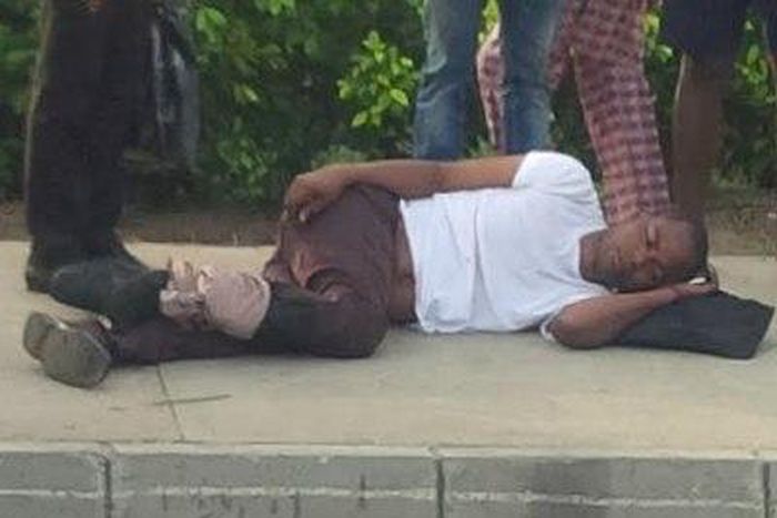 Man rescued from burning car