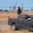 A still image from video released May 17, 2016 shows forces loyal to Libyan unity government celebrating the recapture of Abu Grain, one of the main checkpoints south of the city of Misrata, Libya from Islamic State.