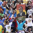 Thousands of Zimbabweans rally for Mugabe after war veteran's rebuke