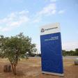 A cow is seen near the AngloAmerican sign board outside the Mogalakwena platinum mine in Mokopane , north-western part of South Africa , Limpopo province May 18, 2016. REUTERS/Siphiwe Sibeko