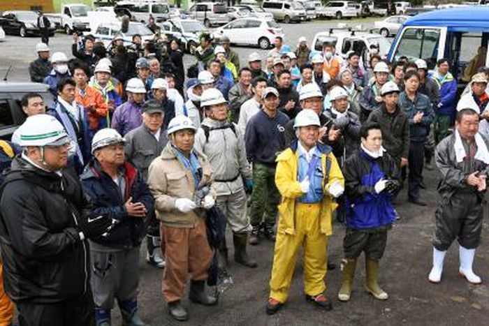 Members of search party for a 7-year-old boy who went missing on May 28, 2016 after being left behind by his parents, celebrate after the boy was found alive, in Nanae town on the northernmost Japanese main island of Hokkaido, Japan, in this photo take...