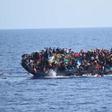 Migrants are seen on a capsizing boat before a rescue operation by Italian navy ships "Bettica" and "Bergamini" (unseen) off the coast of Libya in this handout picture released by the Italian Marina Militare on May 25, 2016.