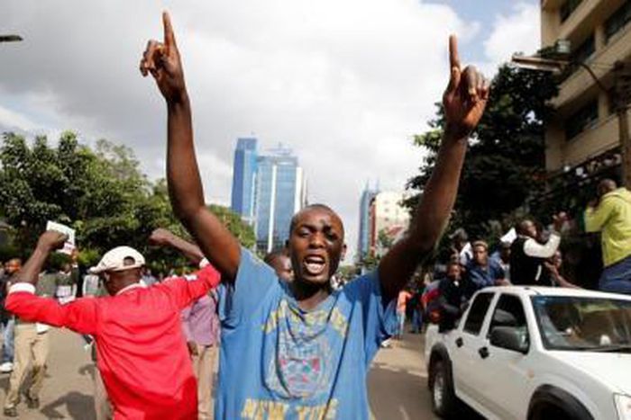 Kenyan opposition Coalition of Reform and Democracy (CORD) supporters protest at the premises hosting the headquarters of Independent Electoral and Boundaries Commission (IEBC) to demand the disbandment of the electoral body ahead of next year"s electi...