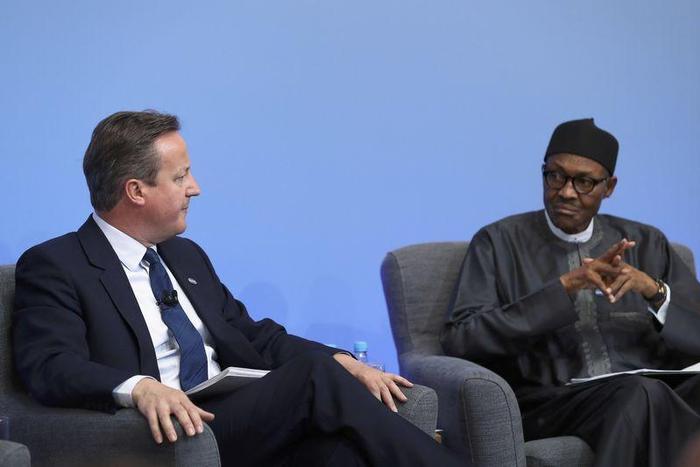 Nigerian President Muhammadu Buhari listens as British Prime Minister Cameron opens the international anti-corruption summit on May 12, 2016 in London, England. REUTERS/Dan Kitwood/Pool