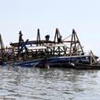 Residents work to dismantle the Makoko floating school after it collapsed in the Makoko fishing community on the Lagos lagoon, Nigeria June 8, 2016.