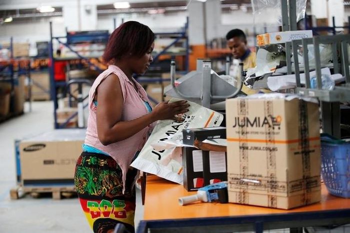 A woman works at the packaging unit at a warehouse for an online store, Jumia in Ikeja district, in Nigeria's commercial capital Lagos June 10, 2016.