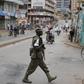 An Ugandan soldier patrols a street in Kampala, Uganda February 20, 2016. REUTERS/Goran Tomasevic