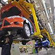 An employee works at an assembly line at a Ford manufacturing plant in Chongqing municipality April 20, 2012.