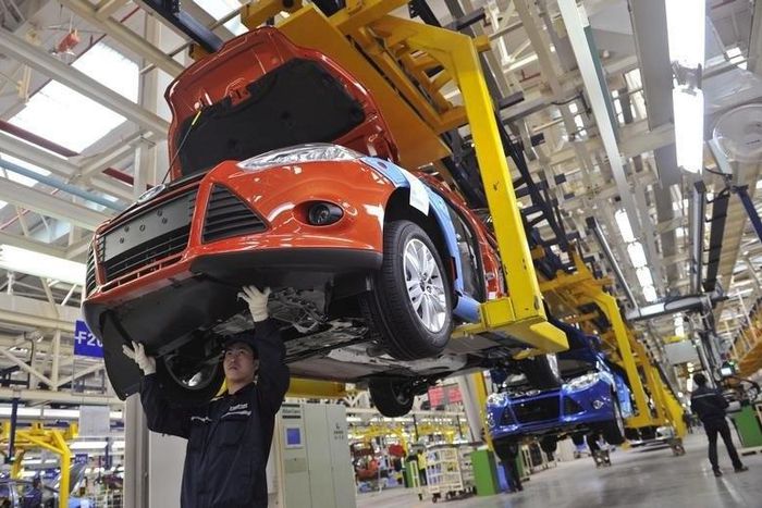 An employee works at an assembly line at a Ford manufacturing plant in Chongqing municipality April 20, 2012.