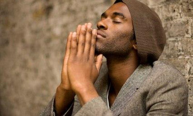 Praying black man
