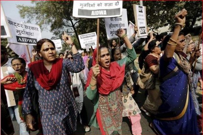Activists seen protesting the rape outside a police station