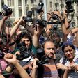 Egyptian journalists hold up their cameras outside the Egyptian Press Syndicate in downtown Cairo, Egypt April 28, 2016, during a protest against the interior minister following the arrest of colleagues for covering anti-government demonstrations.