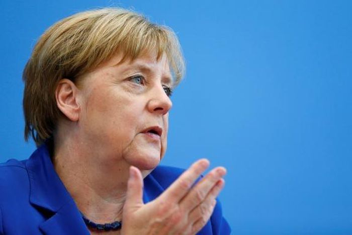 Merkel says believes she acted responsibly after attacks