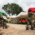 Malian army officers carry a coffin on July 21, 2016 in Segou during a funeral ceremony 