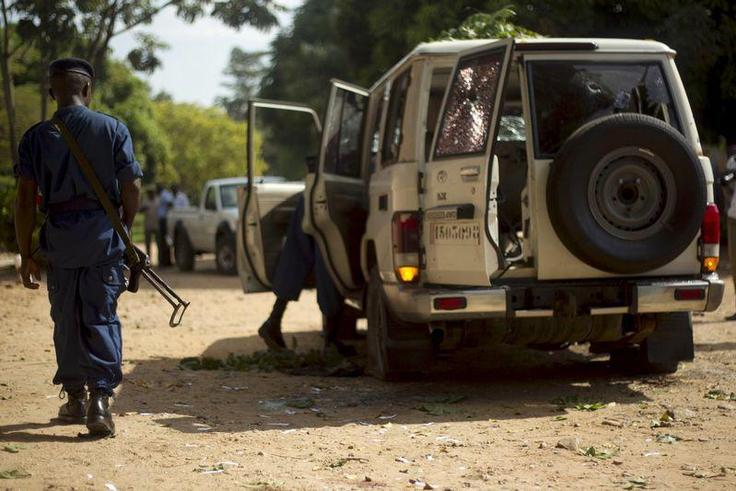 A policeman walks at the crime scene where Burundian General Athanase Kararuza was attacked and killed by unknown gunmen in Ntahangwa commune, north of the capital Bujumbura, April 25, 2016.