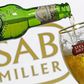 Photo illustration of beer flowing from a bottle of Stella Artois into a glass, seen against a SAB Miller logo, November 5, 2015.   REUTERS/Dado Ruvic/Illustration/File Photo