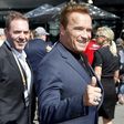 Actor Arnold Schwarzenegger reacts as he arrives at the Australian Formula One Grand Prix in Melbourne.