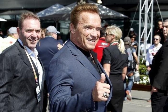 Actor Arnold Schwarzenegger reacts as he arrives at the Australian Formula One Grand Prix in Melbourne.