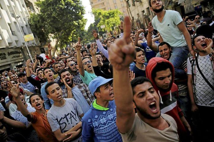 FIle picture of Egyptian protesters and Muslim Brotherhood members shouting slogans against President Abdel Fattah al-Sisi and the government during a demonstration protesting the government's decision to transfer two Red Sea islands to Saudi Arabia, i...