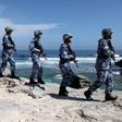 Soldiers of China's People's Liberation Army (PLA) Navy patrol at Woody Island, in the Paracel Archipelago, which is known in China as the Xisha Islands, January 29, 2016. REUTERS/Stringer
