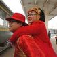 Chinese couple ditch car, groom carries bride on back to wedding venue