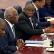 Angola's President Jose Eduardo dos Santos (C) listens to China's Premier Li Keqiang (not pictured) at the Great Hall of the People in Beijing, June 9, 2015.