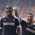 Odion Ighalo and Troy Deeney celebrating a Watford goal against Arsenal on Sunday, March 13