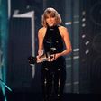 Taylor Swift accepting her award at the iHeartRadio Music Awards 2016