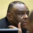 Former Congo vice-president Jean-Pierre Bemba looks up when sitting in the courtroom of the International Criminal Court to stand trial with Aime Kilolo Musamba, Jean-Jacques Mangenda Kabongo, Fidele Babala Wandu and Narcisse Arido, on charges includin...