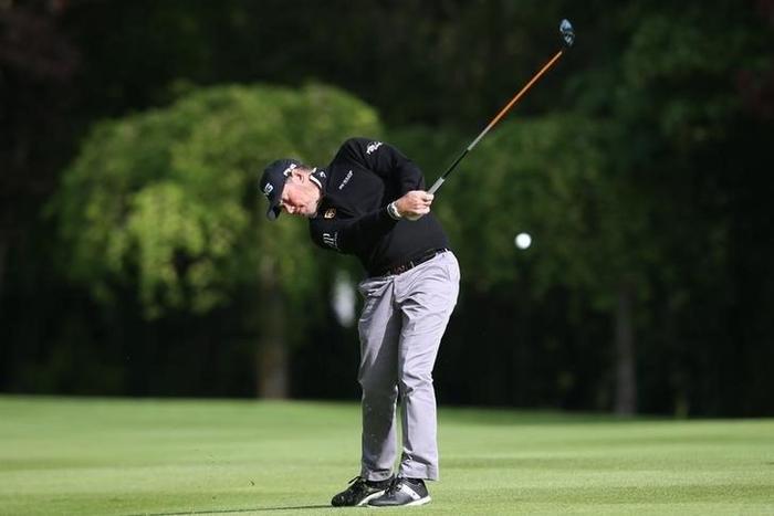 England's Lee Westwood plays his second shot at the 10th hole during the second round