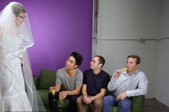 Men try wedding dresses for the first time