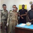 The suspects, Anthony Ifeanyi Okafor and Paschal Adibe with Cambodian police officials