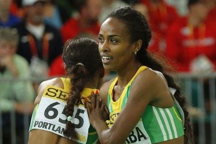 Genzebe Dibaba (R) and Meseret Defar, both of Ethiopia, embrace after the women's 3000 meters final during the IAAF World Indoor Athletics Championships in Portland, Oregon March 20, 2016. REUTERS/Mike Blake