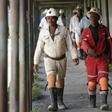 Miners walk at the end of their shift at the Anglo Platinum's Khuseleka shaft 1 mine in Rustenburg, northwest of Johannesburg, January 15, 2013.