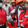 Kenya Red Cross rescuers evacuate a woman from the rubble of a six-storey building that collapsed last Friday after days of heavy rain, in Nairobi, Kenya May 5, 2016.