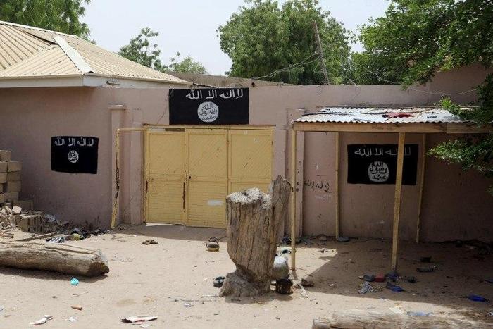 A wall painted by Boko Haram is seen in Damasak March 24, 2015. B