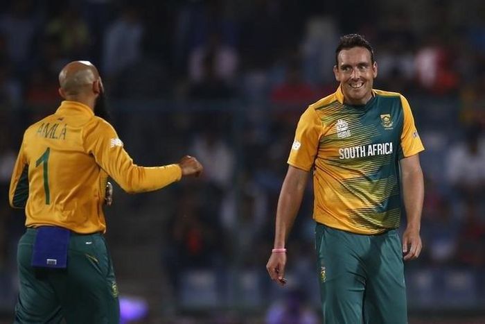 South Africa's Kyle Abbott (R) celebrates with his teammate Hashim Amla after taking the wicket of Sri Lanka's Rangana Herath.