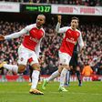 Alexis Sanchez, Theo Walcott and Mesut Ozil celebrate Arsenal's goal against Leicester City on Sunday, February, 14