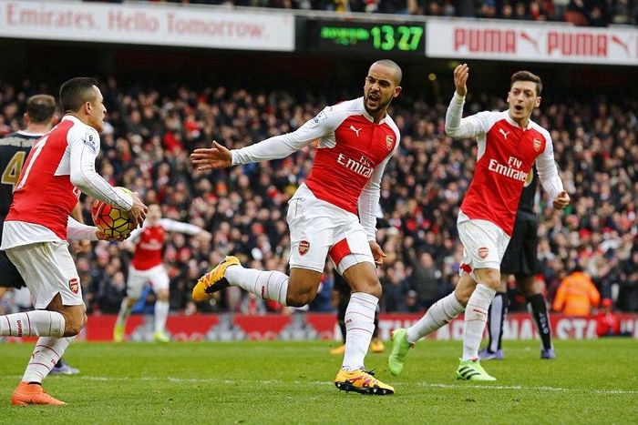 Alexis Sanchez, Theo Walcott and Mesut Ozil celebrate Arsenal's goal against Leicester City on Sunday, February, 14