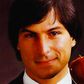Steve Jobs holding an Apple
