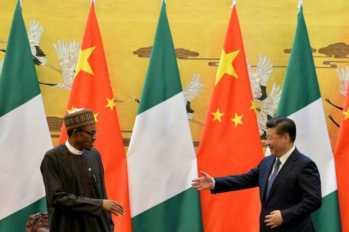 President of the Federal Republic of Nigeria, Muhammadu Buhari (L) and Chinese President, Xi Jinping shake hands during a signing ceremony at the Great Hall of the People in Beijing, April 12, 2016. REUTERS/Kenzaburo Fukuhara/Pool