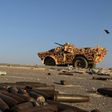 A military vehicle used by fighters from the pro-government forces loyal to Libya's Government of National Unity (GNA) is seen near ammunition casing on August 3, 2016 in Sirte during an operation against jihadists of the Islamic State group 